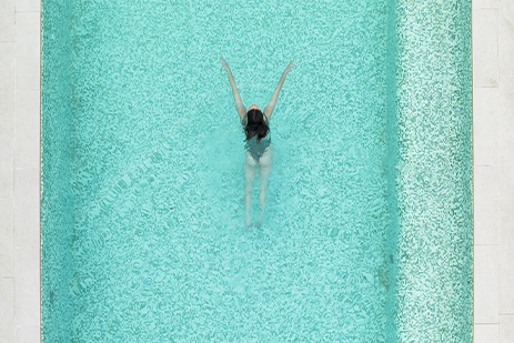 Girl swimming in the pool at THE NICI
