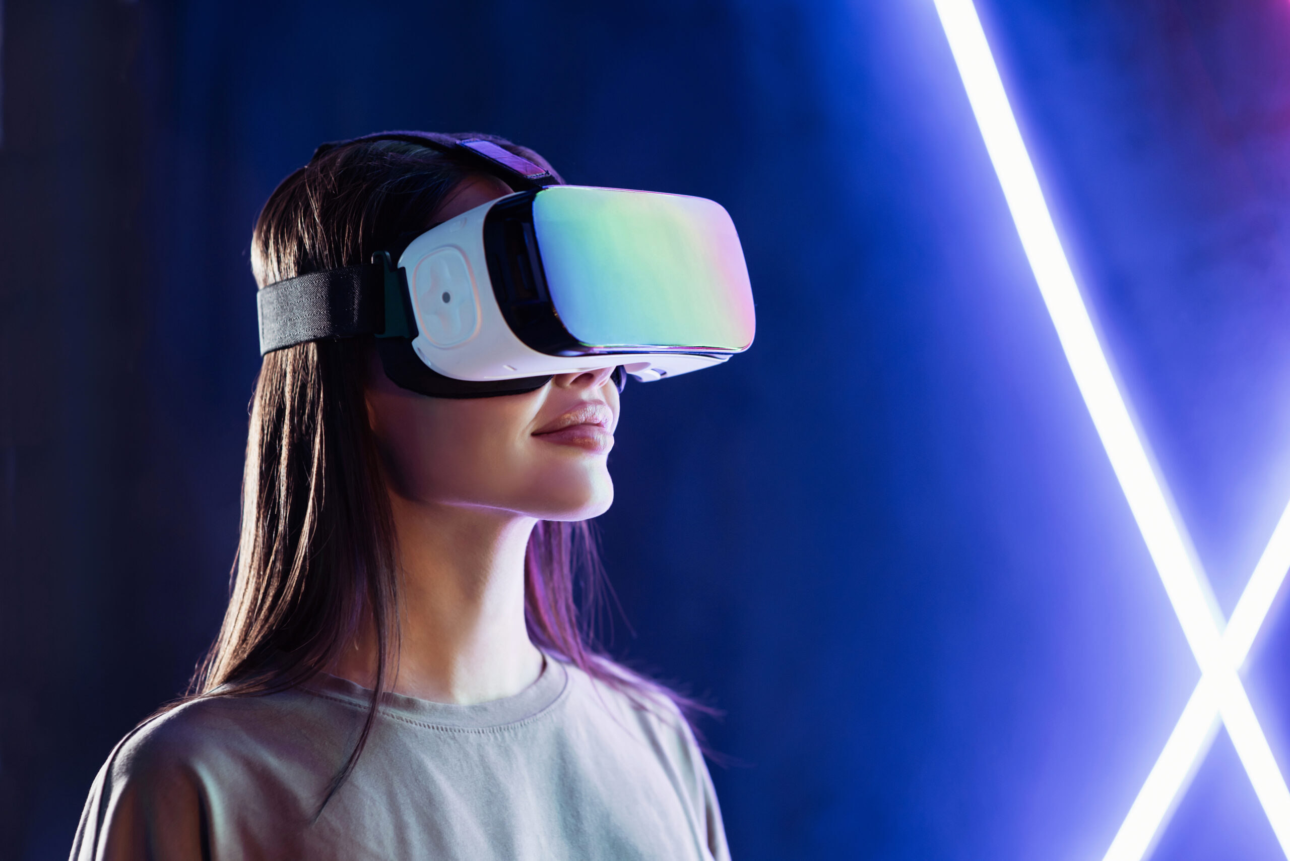 Young woman using virtual reality headset