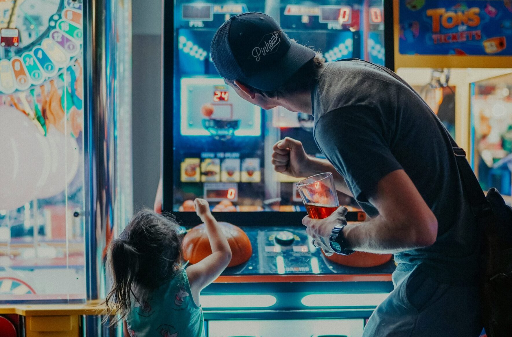 child with parent at arcade